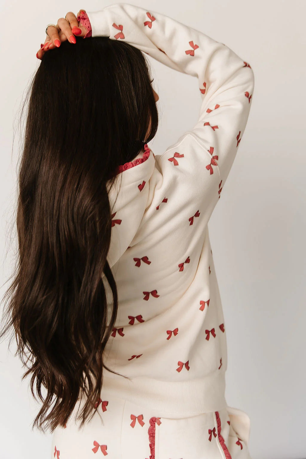 Comfort Zone Hoodie Bundled in Bows by Ampersand Avenue